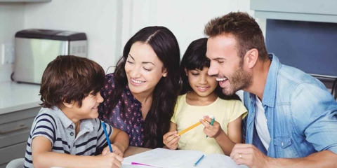 A family of four drawing together