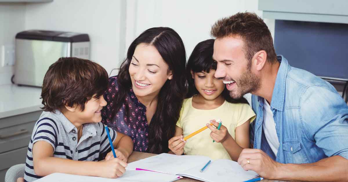 A family of four drawing together