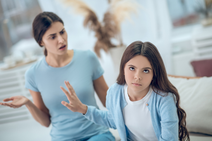 daughter dismissing what mother is saying